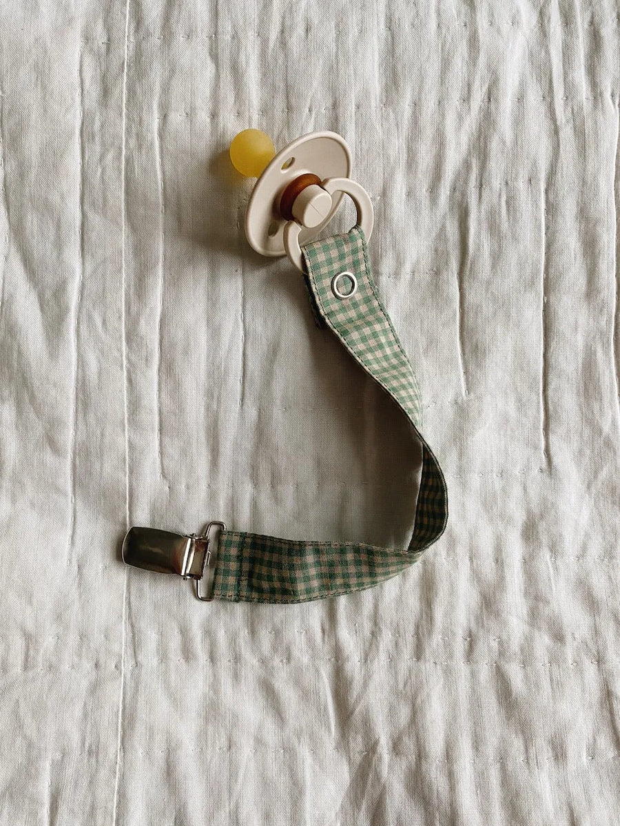 Pacifier clip green check