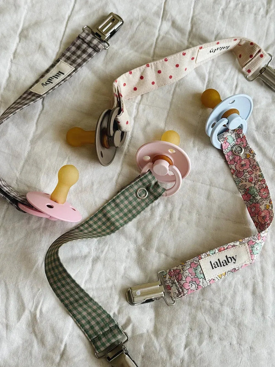 Pacifier clip green check